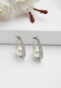 Boucles d'oreilles emblématiques en perles Sling